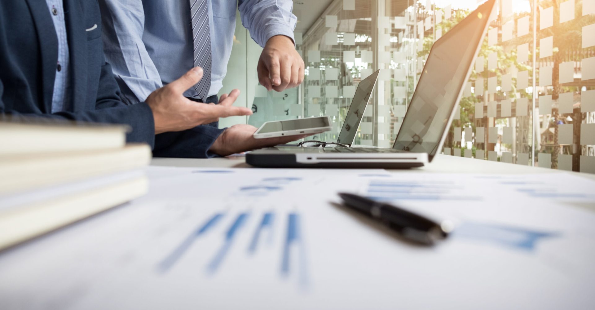 Business adviser analyzing financial figures denoting the progre