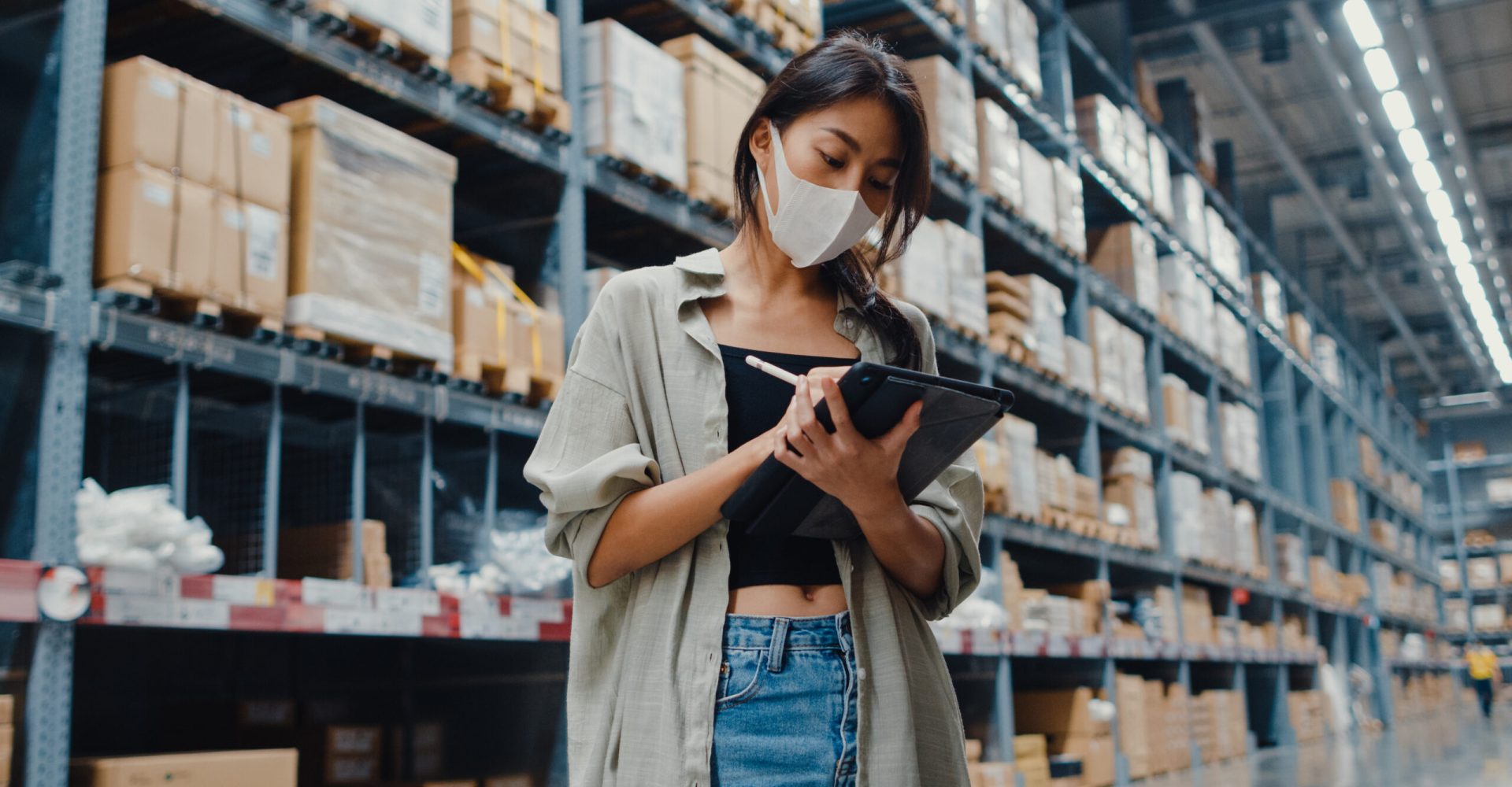 Young Asia businesswoman manager wear face mask looking for good