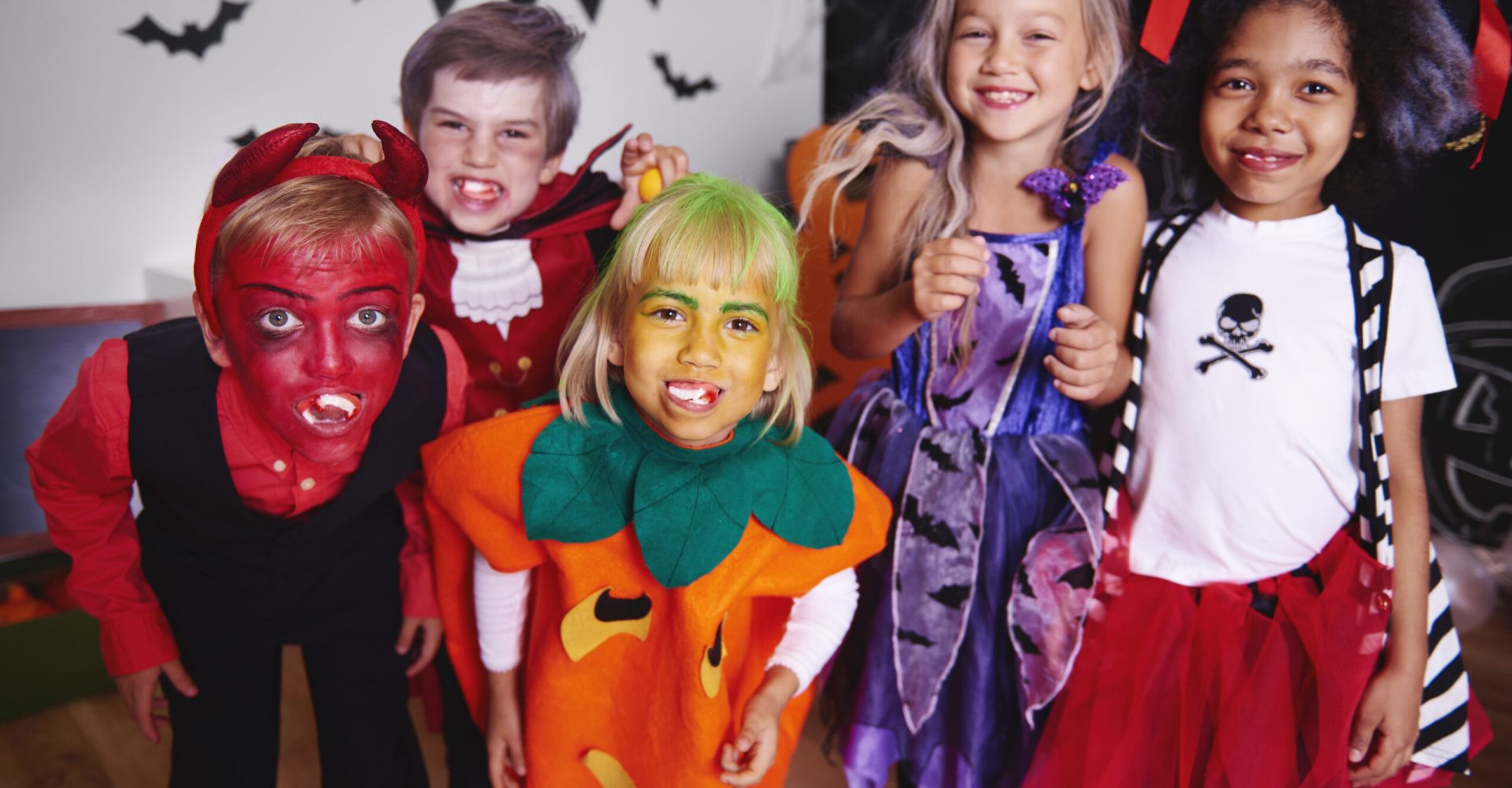 Kids posing  in halloween costume