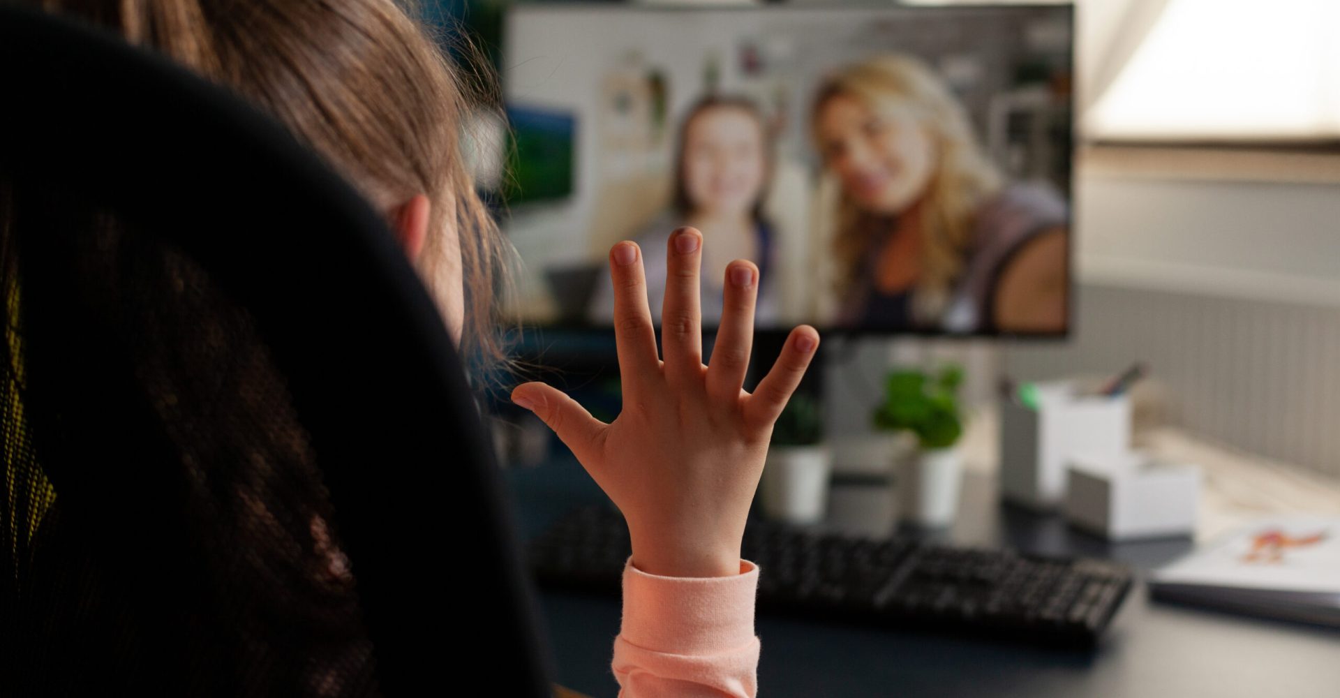 Schoolchild greeting remote friends discussing school leeson
