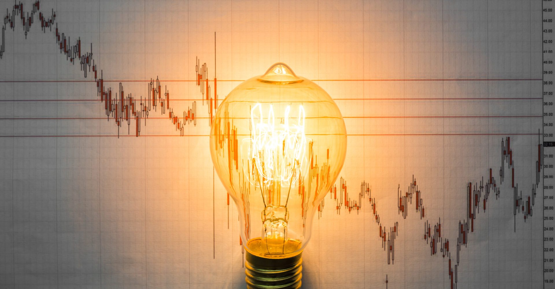 Light bulb with business graph
