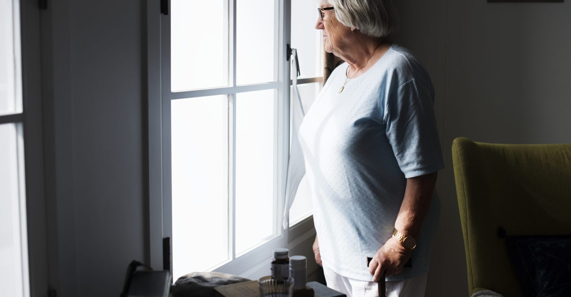 Senior woman standing alone at home