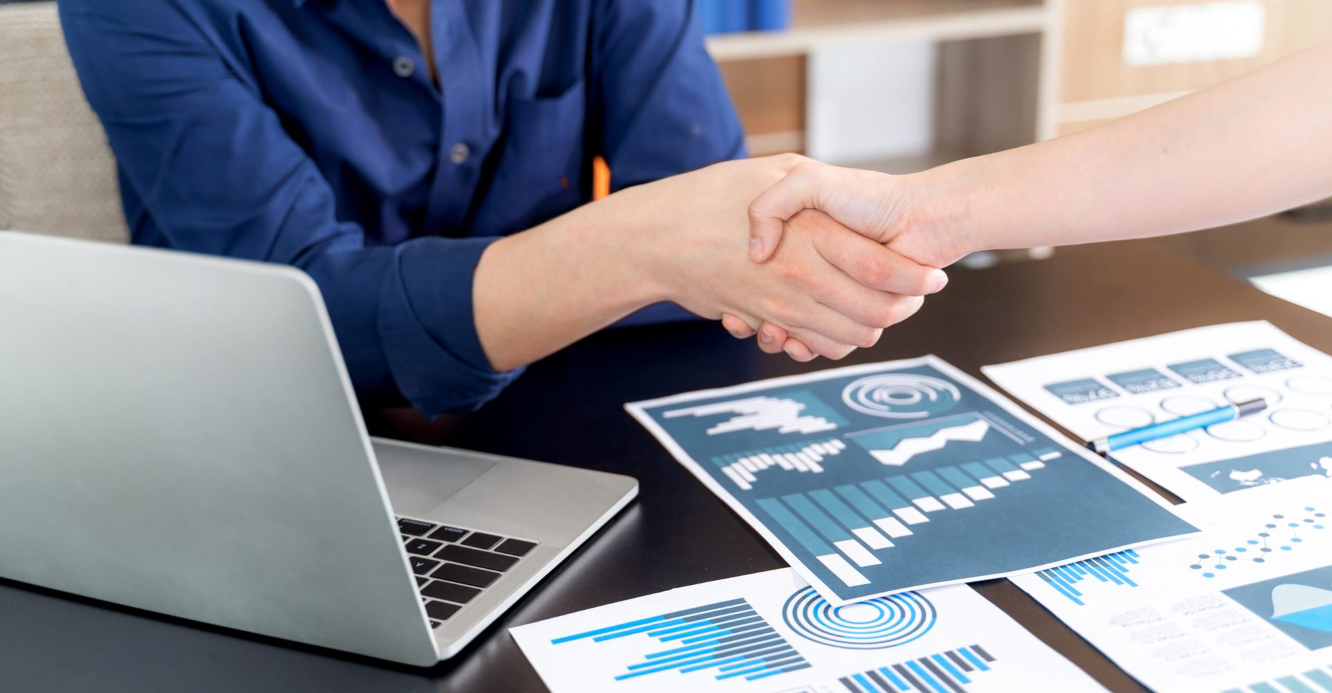 Selective focus young man handshake with someone at office